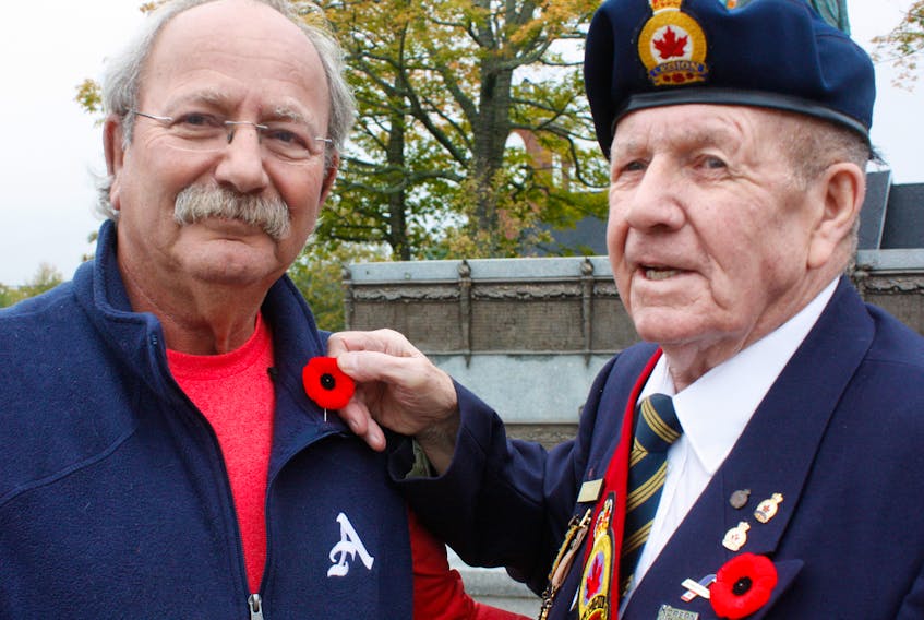 Jack Perry pins a poppy on Amherst Mayor David Kogon to begin the Poppy campaign leading up to Remembrance Day. - Tom McCoag-Town of Amherst photo