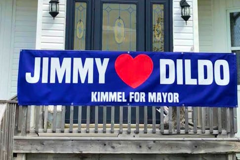 Campaign posters to have Jimmy Kimmel elected mayor are posted on various homes and businesses in Dildo — including this one at Dildo Cove Coffee and Krafts — in the hopes that the American late-night talk show host will visit the town.