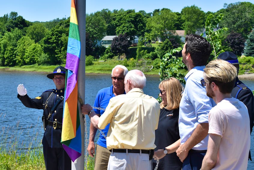 Gerard Veldhoven, raises the rainbow flag during a ceremony hosted in New Glasgow Monday. Events have been planned for throughout the week in celebration of Pride Week.