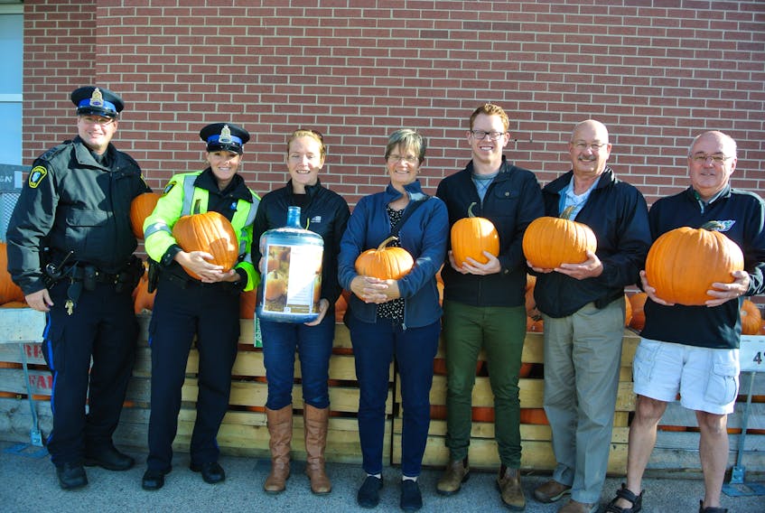 Pumpkins for Poverty is returning for its 11th season in support of the Amherst food bank. Members of Empowering Beyond Barriers - including (from left) Const. Tom Wood and Const. Michele Harrison of the Amherst Police Department, Alison Lair of the Cumberland YMCA, Kate Jacobs, Jeff MacNeil from the Cumberland YMCA, Ray Bristol from the Cumberland County Senior Safety Program and Kim Campbell from Empowering Beyond Barriers – are busy preparing for Oct. 19 when Pumpkins for Poverty will be held in Victoria Square from 11 a.m. to 1:30 p.m.