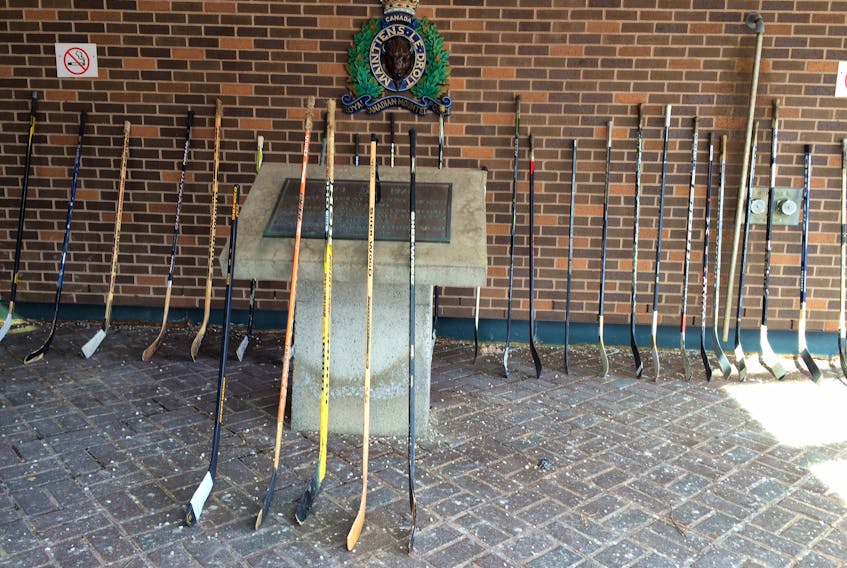 Hockey sticks have been placed outside the RCMP “B” Division Newfoundland and Labrador headquarters at White Hills in St. John’s in tribute to the victims of the Humboldt Broncos bus crash in rural Saskatchewan last Friday that claimed 15 lives.