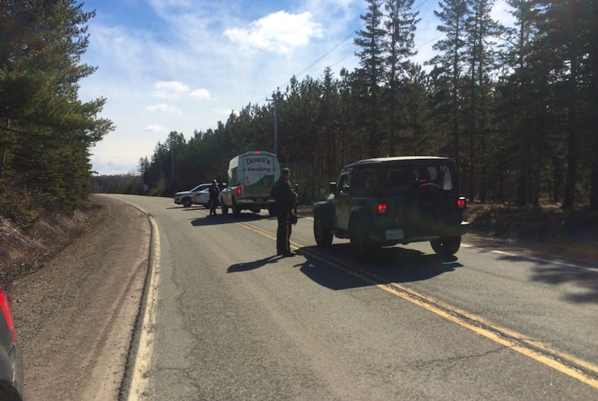 RCMP stopped vehicles on Portapique Beach Road on Sunday morning following a shooting in the area, while suspect Gabriel Wortman was still at large in a car resembling an RCMP vehicle. - Harry Sullivan/Saltwire Network