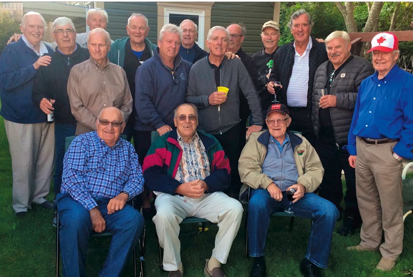 Players and others associated with Canada’s national men’s hockey teams in the 1960s, 1970 and 1980 under Fr. David Bauer kicked off their 2019 reunion in St. John’s Tuesday night with a barbeque at Clyde Flight’s home. Among those on hand were (from left) seated: Ray Cadieux, Marshall Johnston, Barry McKenzie; standing: Phil Reimer (who covered those teams for many years with the CBC), Rick Noonan (who was head trainer and later, general manager), Ross Parke, Corby Adams, Grant Moore, Ron Paterson, Paul Conlin, Roger Bourbonnais, Steve King, Morris Mott, Jim Irving, Wayne Freitag and George Faulkner. Missing from the photo is Billy MacMillan, – Robin Short/The Telegram