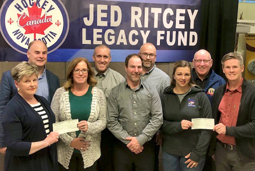 On Monday, it was announced the Jed Ritcey Legacy Fund will disperse almost $20,000 to local minor hockey associations this season. Taking part in the presentation are, front row, from left, Betty Ritcey (Jed’s wife), Marilyn Hutchinson (Tatamagouche minor hockey), Josh Boulton (South Colchester minor hockey), Charlene Bagnell, (Colchester female hockey) and Matt Moore (board member); second row, Dave Ritcey (board member), Andrew St. Coeur (Truro minor hockey), Matthew White (South Colchester minor hockey) and Bob Taylor (board member).