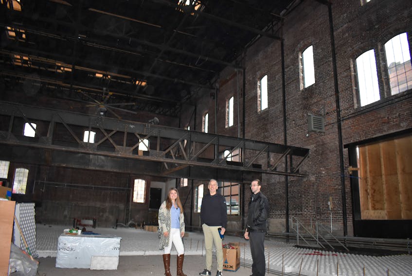 Alex MacDonald, Jamie MacGillivray and Marlin Plett stand inside the Roseland which is being renovated to become a restaurant.