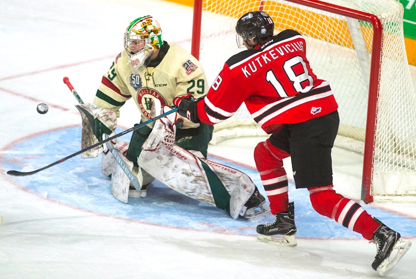 Quebec Remparts centre Luke Kutkevicius tries to tip the puck past Halifax Mooseheads goalie Cole McLaren during the second period of Saturday night’s QMJHL game at the Scotiabank Centre. (Ryan Taplin/The Chronicle Herald)