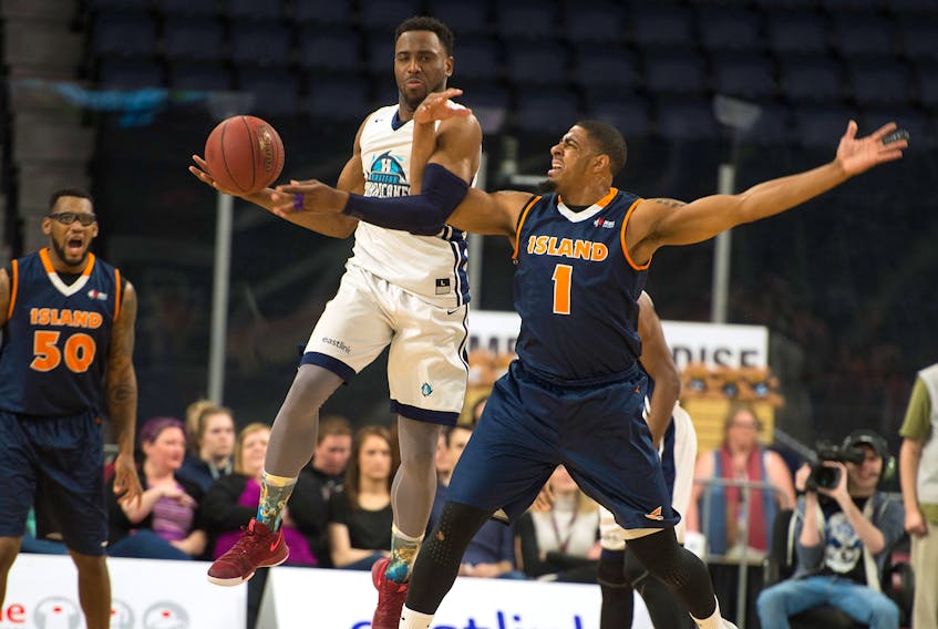 Halifax Hurricanes guard Antoine Mason steals a pass intended for Island Storm guard Chris Johnson during the first half of Thursday night’s NBL Canada playoff game at the Scotiabank Centre. Ryan Taplin/The Chronicle Herald