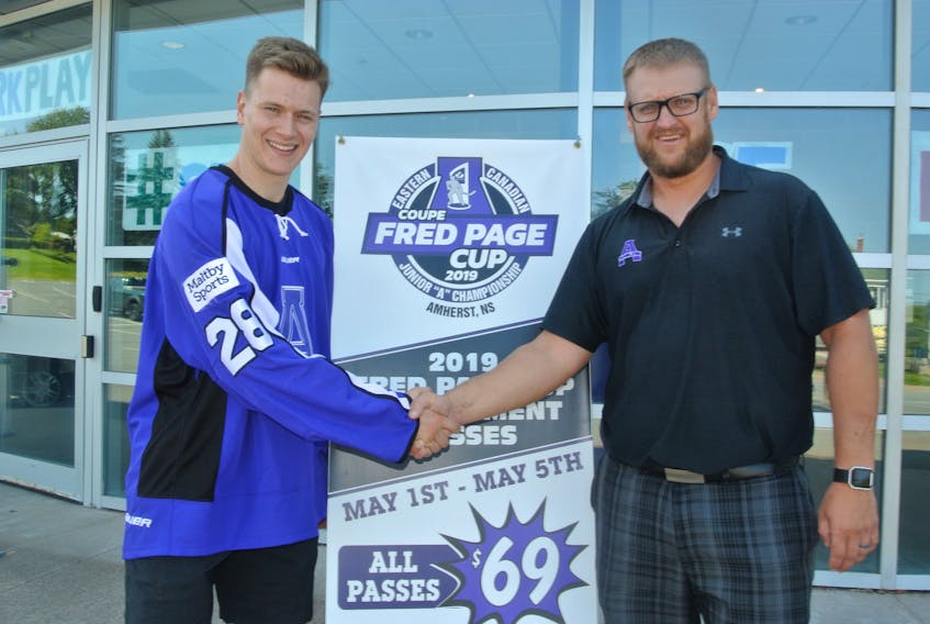 Matt Williams (left) is welcomed to the Amherst CIBC Wood Gundy Ramblers by coach and general manager Jeff LeBlanc.