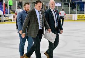 Amherst Ramblers coach Doug Doull walks off the ice with his assistant coaches at the Amherst Stadium following a game last season. Both Doull and GM Jeff LeBlanc have had their contracts renewed for three seasons. File