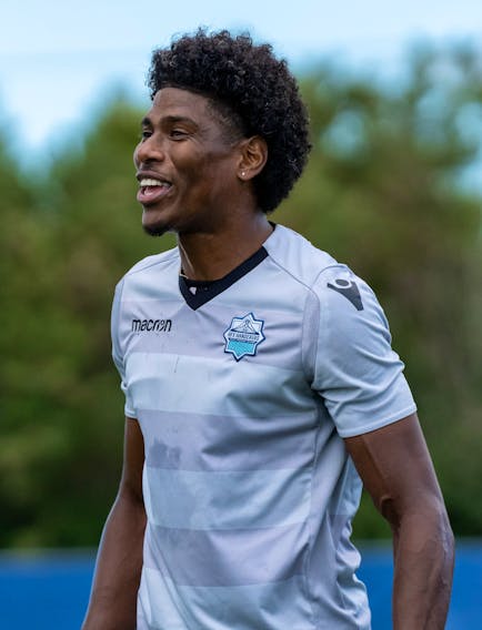 HFX Wanderers captain Andre Rampersad shares a laugh with his teammates during a practice last season. - HFX WANDERERS