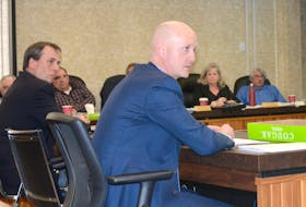 Mac Davis, right, and Ian Ripley addressed councillor Lynne Welton’s concerns about clear-cut logging after they gave a presentation on behalf of the 40 forestry workers who packed into the Cumberland County council chambers on May 1.