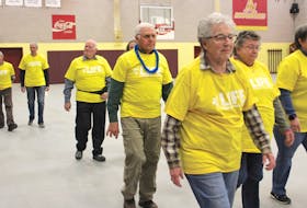 Local cancer survivors make their way around the track at the Mount Allison athletic centre Friday afternoon for a special Survivor’s Victory Lap to kick off the annual Relay for Life.