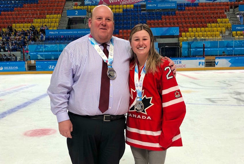 Amherst native Terry Rhindress and Abby Beale of Sackville, N.B. stand with the silver medals they won with Team Canada at the 2019 Winter Universiade in Krasnoyarsk, Russia in March.