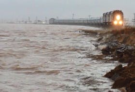 Rising waters from the Bay of Fundy rush up against the CN rail line along the Isthmus of Chignecto route from Nova Scotia to New Brunswick. - Mike Johnson photo