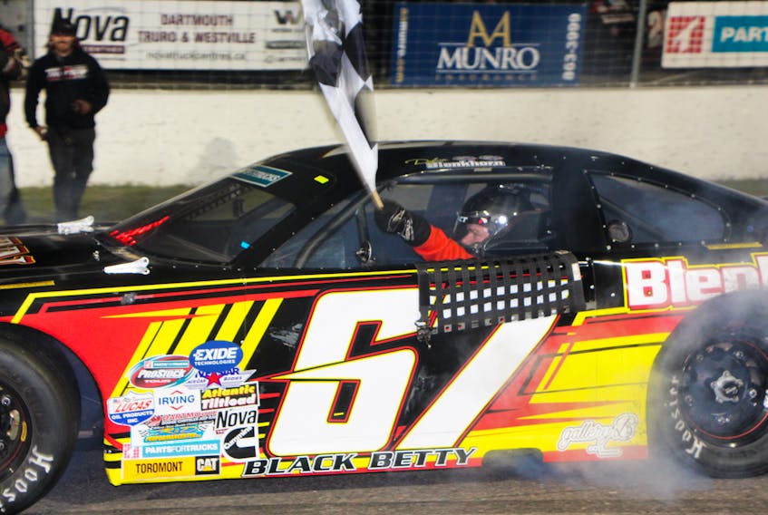 Truro’s Dylan Blenkhorn with the checked-flag following his victory in the Lucas Oil 150, Saturday night at Riverside International Speedway.