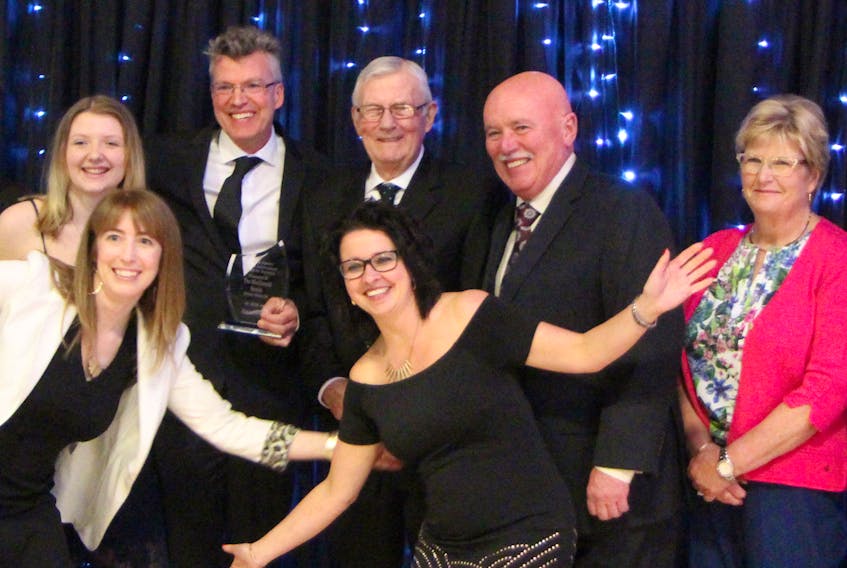 Executive director Amanda Mombourquette (front, left) and Chamber president Diana Martell have some fun with representatives of the MacDonald Family Midway Motors Ltd. during the Strait Area Chamber of Commerce spring AGM gala at the Port Hawkesbury Civic Centre. They were recipients of the Jack Hartery Lifetime Achievement Award for Business. Corey LeBlanc