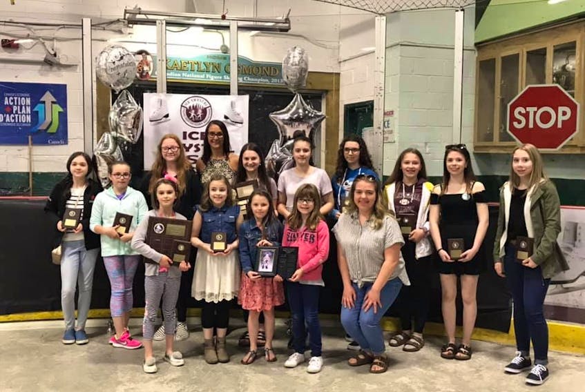 The Ice Crystal Skating Club’s 2018-19 award winners are seen with their coach, Karen Jones.