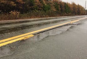 Rain fills a damaged section of the Burin Peninsula Highway between the Winterland branch and Marystown on Monday, Oct. 29, 2018.