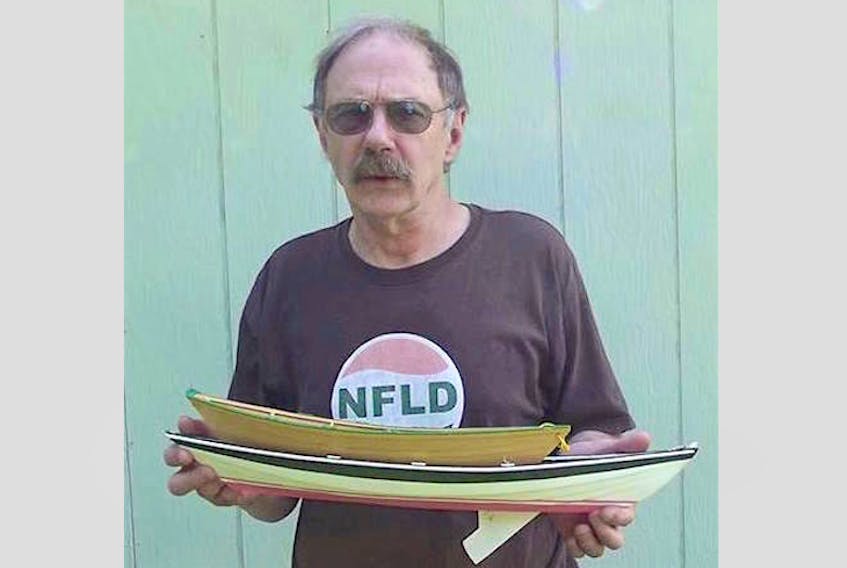 Frank Thornhill with two of his creations – models of a 12-foot bank dory and 21-foot beachcomber dory.