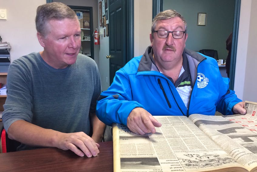 The St. Lawrence Soccer Association has started a project to publish a book about the history of the sport in the community. Researcher David Williams, left, and Hubert Beck, the association’s president, visited The Southern Gazette’s office in Marystown recently to scan though the newspaper’s archives as part of their research.
