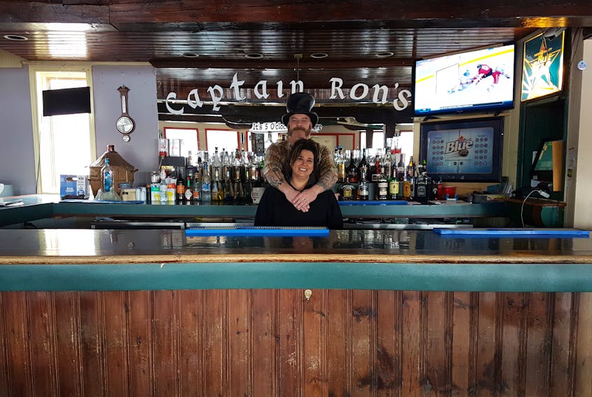 Ron Bungay and Shelley Killips stand at the bar in their new nightspot Captain Ron's.
