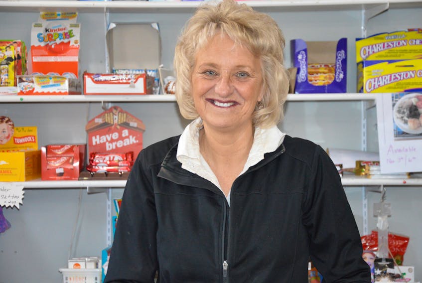 Phyllis Lockyer is at home behind the counter of her roadside store in Lord’s Cove.