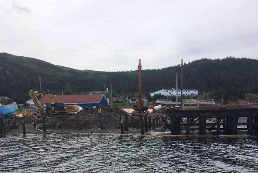 The crew demolishing the wharf in Terrenceville. Council had been speaking with Transport Canada in an effort to save the wharf but were unsuccessful in their attempt.