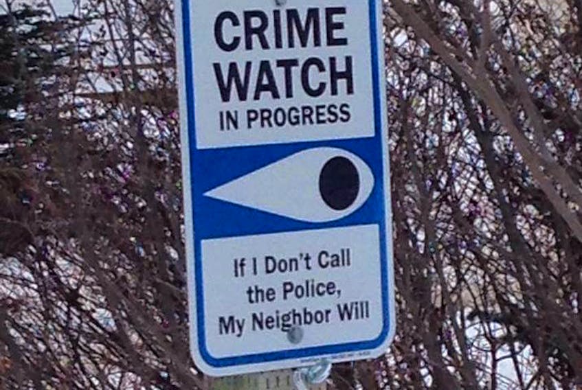 As part of the Neighbourhood Watch program in Red Harbour, signs like these have been posted throughout the community to warn would-be criminals that residents are watching.