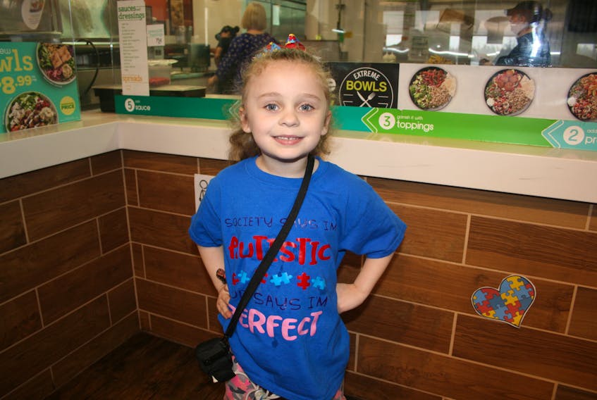 Mya Saint, age five, of Marystown was in Halifax last week where she underwent heart surgery at IWK Health Centre. Mya poses for a photo during an Autism Awareness event held at Extreme Pita in Burin on April 29.