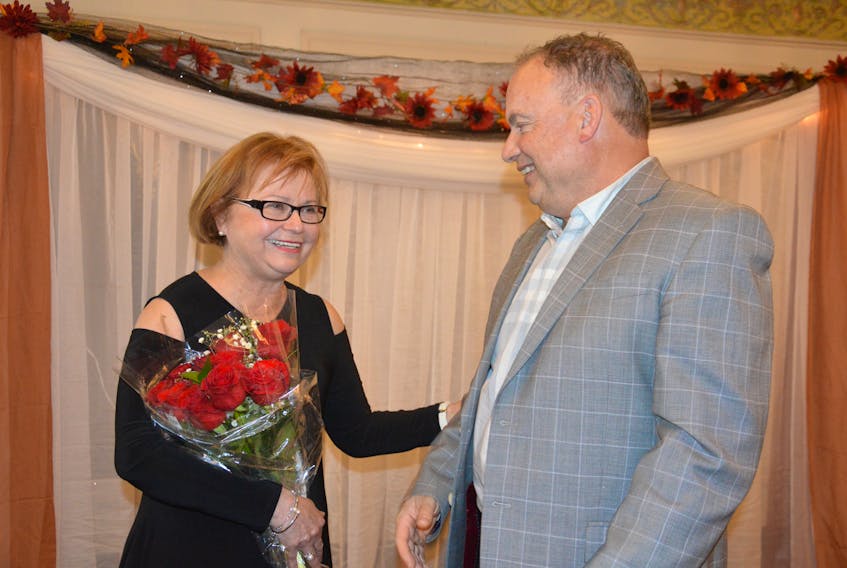 Retired MP Judy Foote spoke with St. Lawrence Mayor Paul Pike following the Burin Peninsula Chamber of Commerce’s 6th Annual Business Awards held on Thursday. Foote, who was the keynote speaker for the event, received a painting and a bouquet of flowers from the chamber of commerce. Colin Farrell/ The Southern Gazette