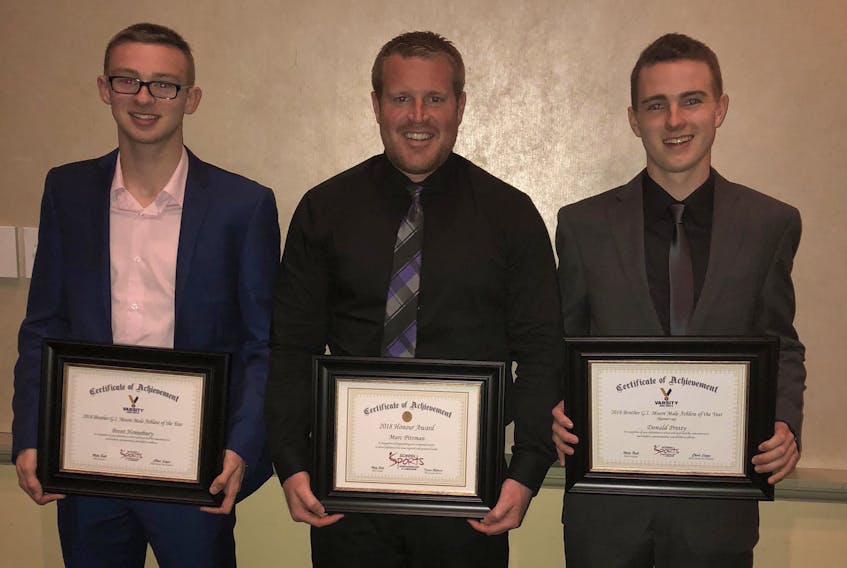 Brent Hennebury, left, and Donald Pretty, right, both students of Lawn’s Holy Name of Mary Academy, were finalists for the School Sports Newfoundland and Labrador Varsity program’s Brother G.I. Moore Male Athlete of the Year for 2018. Hennebury won the award with Pretty first runner-up. Marc Pittman, a physical education teacher and vice principal at St. Joseph’s Academy in Lamaline, received the organization’s Honour Award.