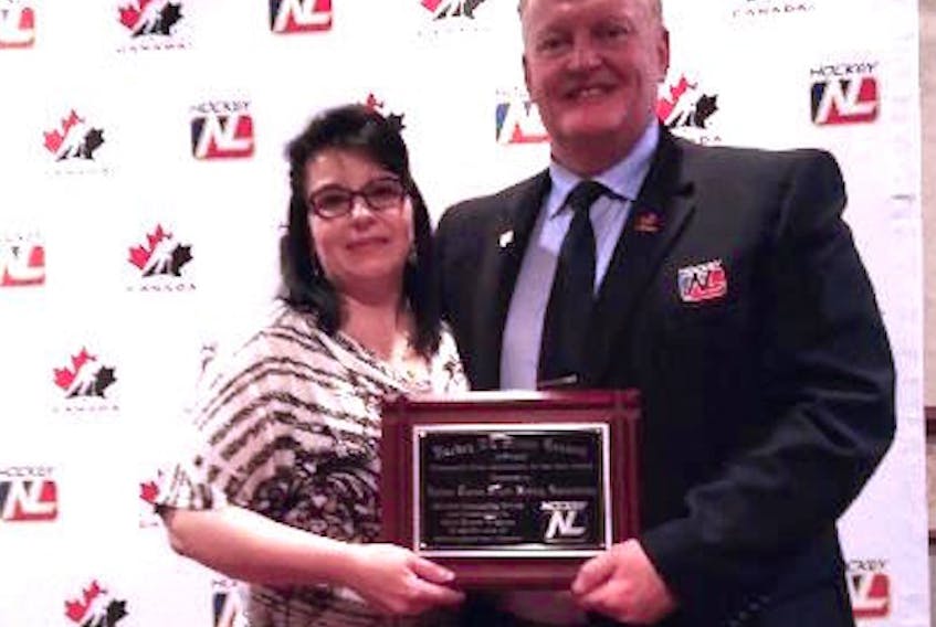 Minor Hockey chair Arnold Kelly (right) presented United Towns Minor Hockey Association president Lynn Downey with the award for Association of the Year during Hockey NL’s annual general meeting earlier this month.