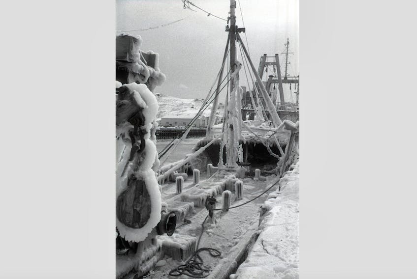 A Burin trawler iced up after arriving in port in the 1960s.
