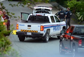 Police guard the scene of an apparent homicide on Craigmillar Ave. in St. John's early Sunday morning. The street has been closed to traffic and residents have been advised to shelter in place.