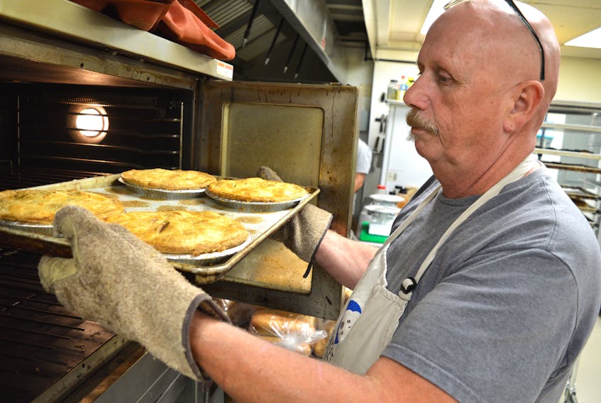 Terry MacLeod works in his Sweet Side of the Moon Bakery and Café in Glace Bay, N.S.