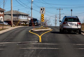 Drivers pass by a traffic-calming island on Colby Drive in Cole Harbour, N.S. on Monday, April 6, 2020.