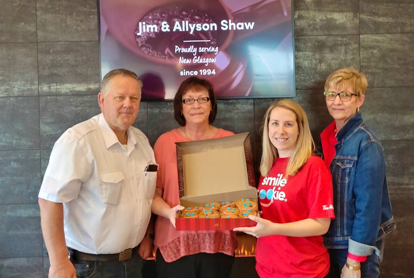 This year’s Smile Cookie campaign is supporting the Pictou County Food Banks and Pictou County Fuel Fund. From left are: Wayne MacLellan of the Pictou East Food Bank, Roseanne MacGregor of Pictou County Fuel Fund, Lindsey Shaw, senior manager at Tim Hortons and Lia LeClair of the Pictou East Food Bank.