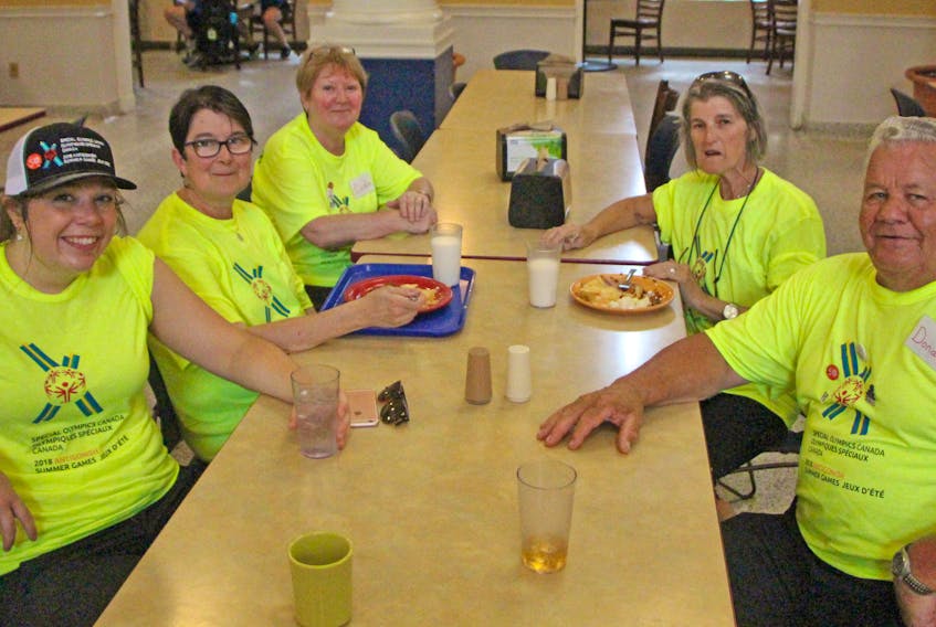 The Special Olympics Canada 2018 Summer Games would not be successful without volunteers, such as Melinda Butler (left, clockwise), Janet Bowman, Caroline Fougere, Bernice Deon and Donald Fougere, who take a break after helping serve more than 800 hungry visitors to St. F.X's Morrison Hall. Corey LeBlanc