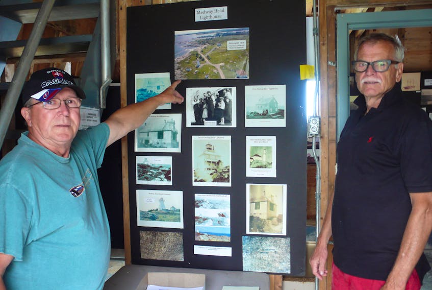 Ray Leger, left, and Donald Allan, right, invite local residents and tourists to drop by the Medway Head Lighthouse this summer to learn some area history and enjoy some spectacular views.