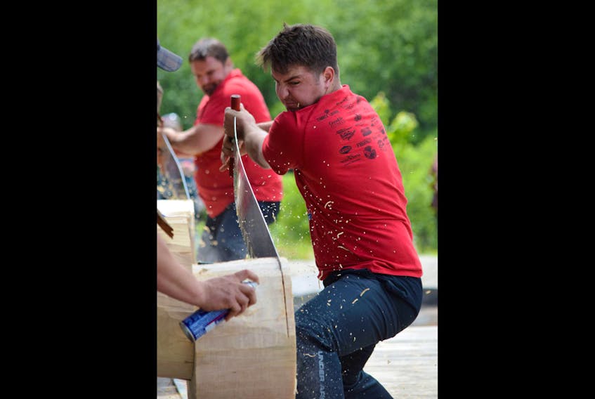 Dane Nickerson and Abby Perry compete in exhibition logrolling at the Nova Scotia Lumberjack Championships in Barrington on June 16-17.