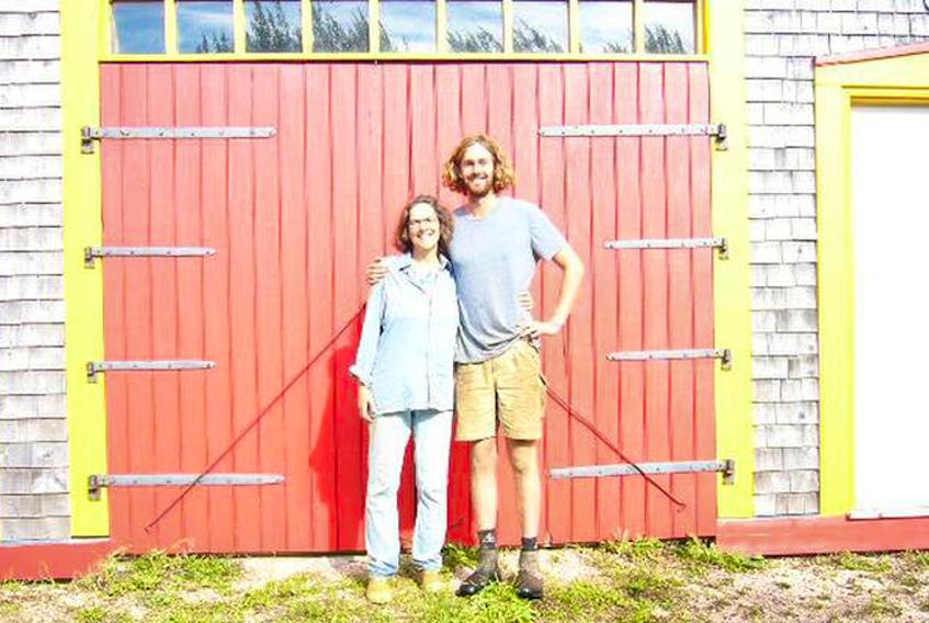 Watershed Farm Owner Camelia Frieberg and employee Josh Heard get ready for Open Farm Day on Sept. 16.