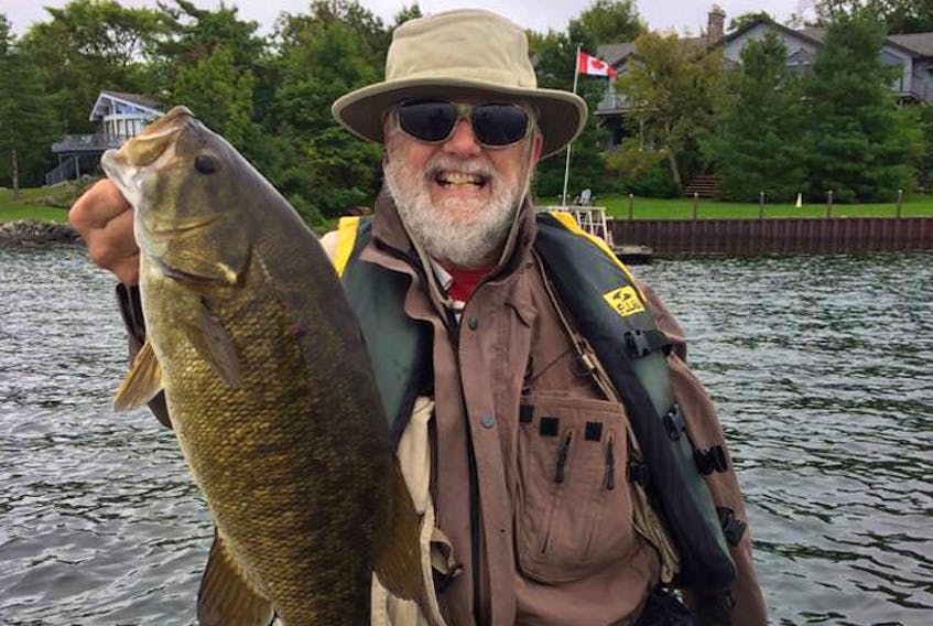 Carroll Randall with the largest smallmouth bass he has ever caught. The bass was caught on Georgian Bay in Ontario.