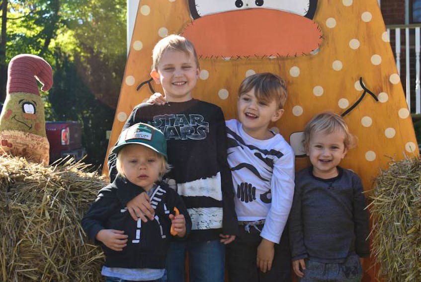 From left: Jack Vierik and the Bordeleau brothers, Atticus, Sawyer and Hendriks, pose during Mahone Bay’s Scarecrow Festival and Antique Fair that was held Sept. 28 to 30.