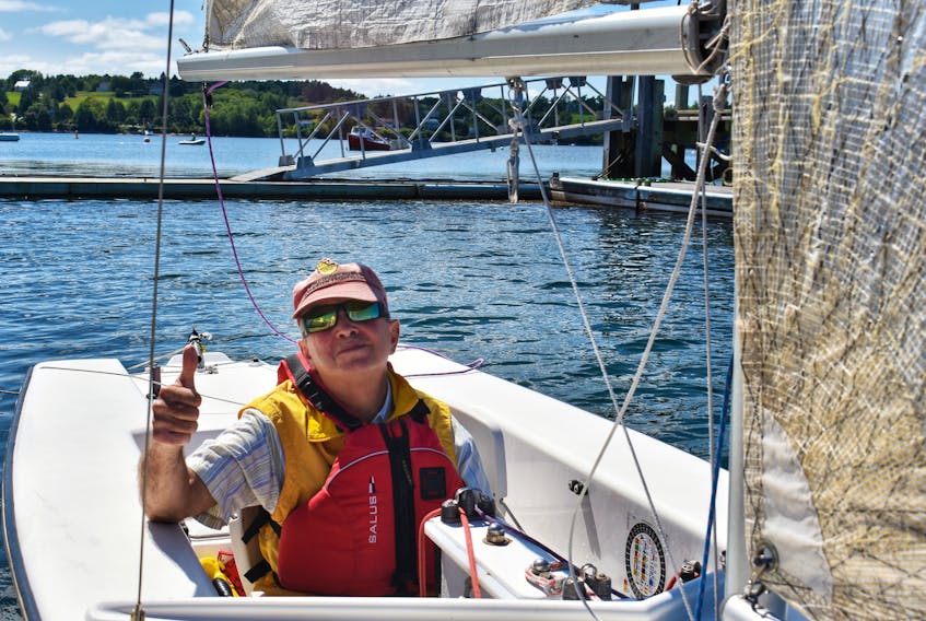 Mark Stewart, who has been participating in the Lunenburg Yacht Club’s Sail Able program for the last three years, poses before heading out for the day.