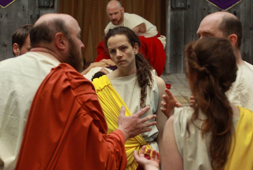Mark Antony watches the conspirators. With Paul Wilson as Antony, Bridget Wareham as Cassius and Steve O’Connell as Brutus. — PAMELA WHELAN PHOTO