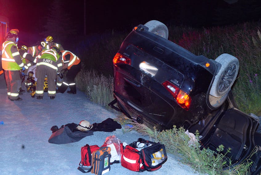 A woman who was a passenger in an SUV that struck a bull moose on the Trans-Canada-Highway (TCH) just outside St. John’s on Saturday night is tended to by first responders before being placed in an Eastern Health ambulance for transportation to the Health Sciences Complex.