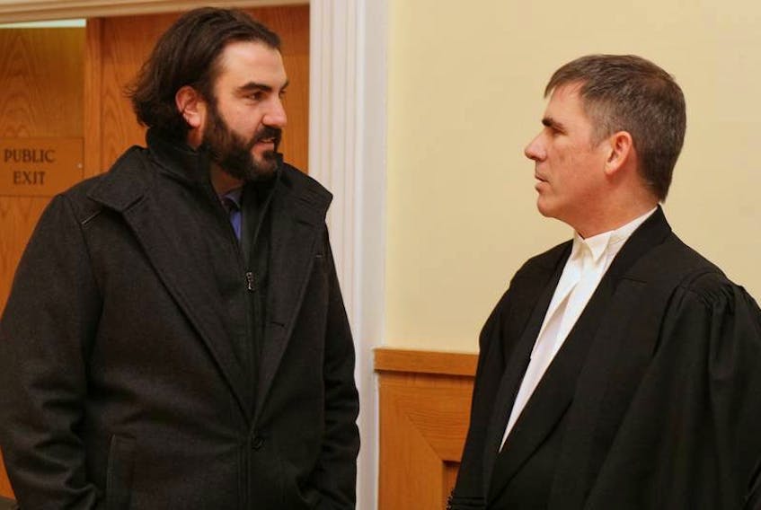 Justin Brake (left) is shown with his lawyer Geoff Budden during a break in his appeal in St. John's in December 2017.