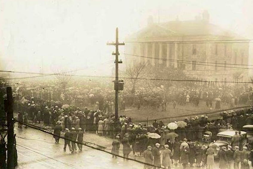 A crowd of nearly 10,000 gathered outside Newfoundland's then-national legislature, the Colonial Building in St. John's, on April 4, 1932, with many ensconced on the steps to the building. Eventually, many of the protesters forced their way inside, causing extensive damage and forcing occupants — including members of the police and politicians — to flee or bar themselves behind doors. — Provincial Archives