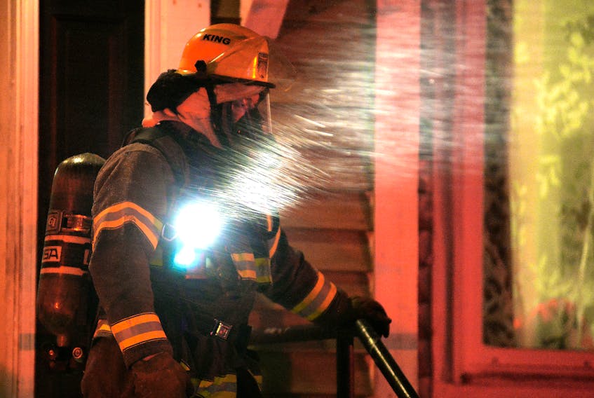 One woman was taken to hospital suffering from smoke inhalation after a house fire in the east end of St. John's Thursday night. Keith Gosse/The Telegram