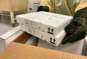 Two trays of Pfizer/BioNTech vaccine doses are shown Tuesday before being stored in an ultra deep freezer at the Health Sciences Centre in St. John’s.